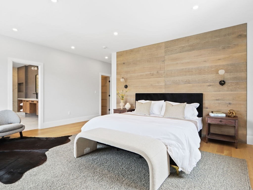 48 Valley View Road Waltham, MA 02452 - Photo 13 of 29 a spacious bedroom with a bed and a couch