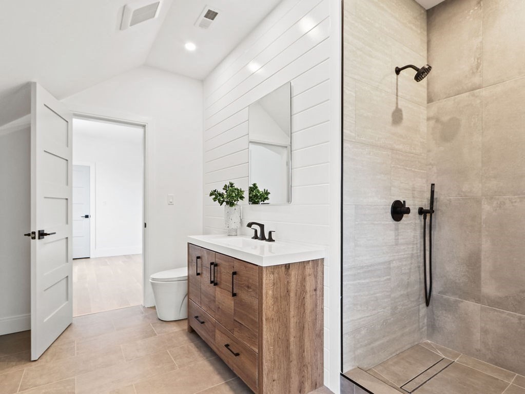 48 Valley View Road Waltham, MA 02452 - Photo 20 of 29 a bathroom with a sink a toilet and shower