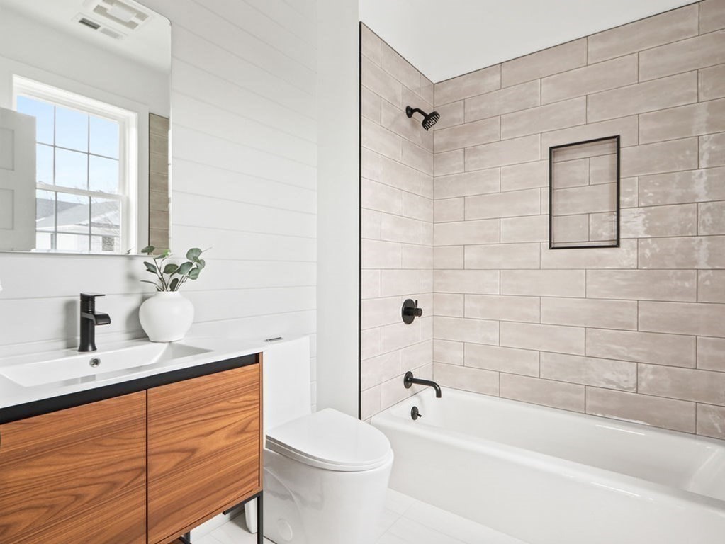 48 Valley View Road Waltham, MA 02452 - Photo 22 of 29 a bathroom with a sink a toilet and bathtub