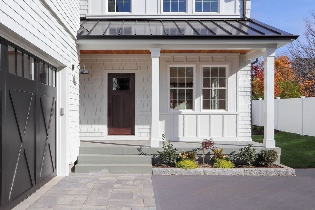 48 Valley View Road Waltham, MA 02452 - Photo 24 of 29 a front view of a house with a garden