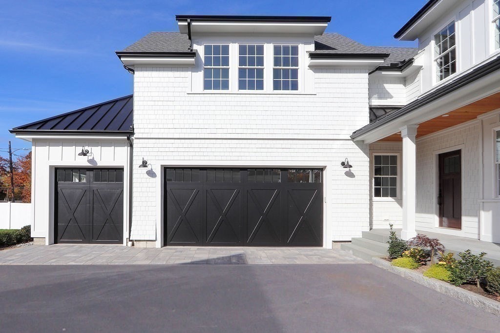 48 Valley View Road Waltham, MA 02452 - Photo 25 of 29 a front view of a house with a garage