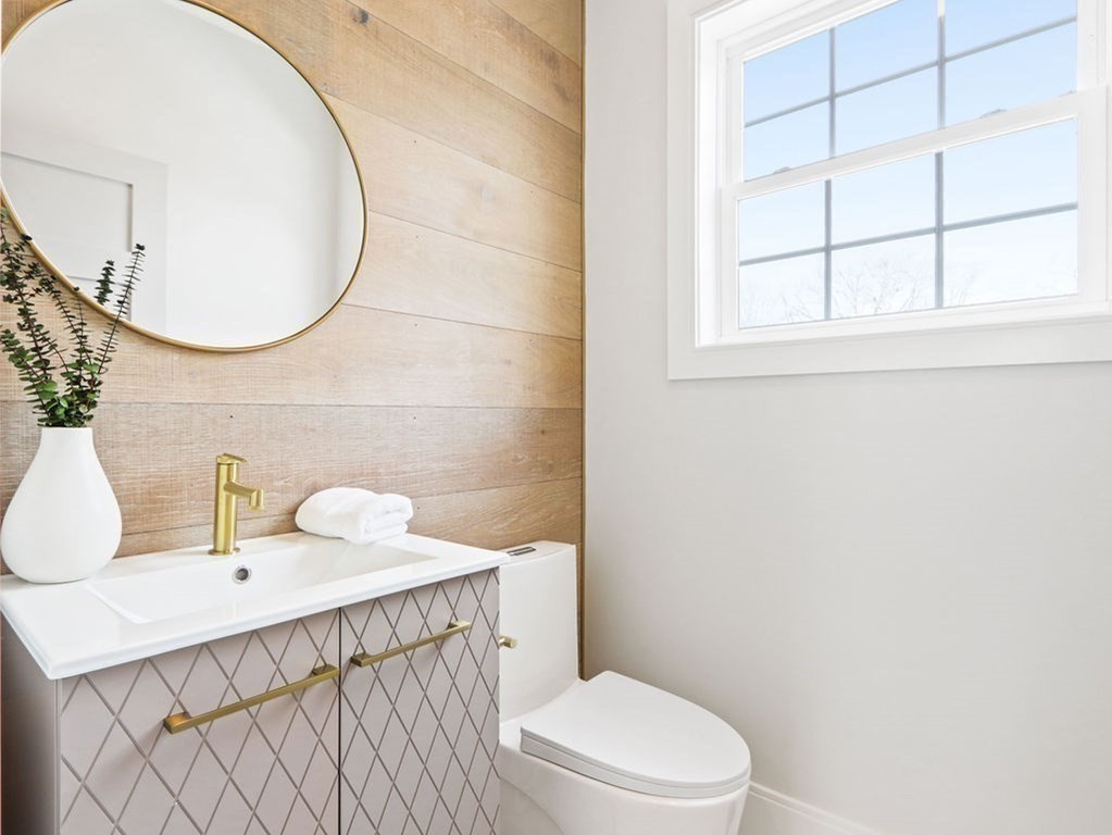 48 Valley View Road Waltham, MA 02452 - Photo 8 of 29 a bathroom with a sink a toilet and a mirror