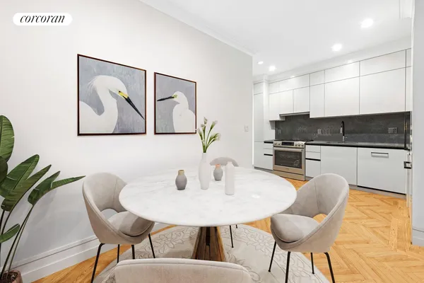 a kitchen with stainless steel appliances white cabinets and a stove