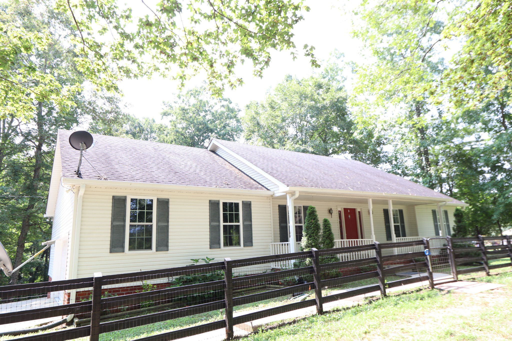 a front view of a house with a porch