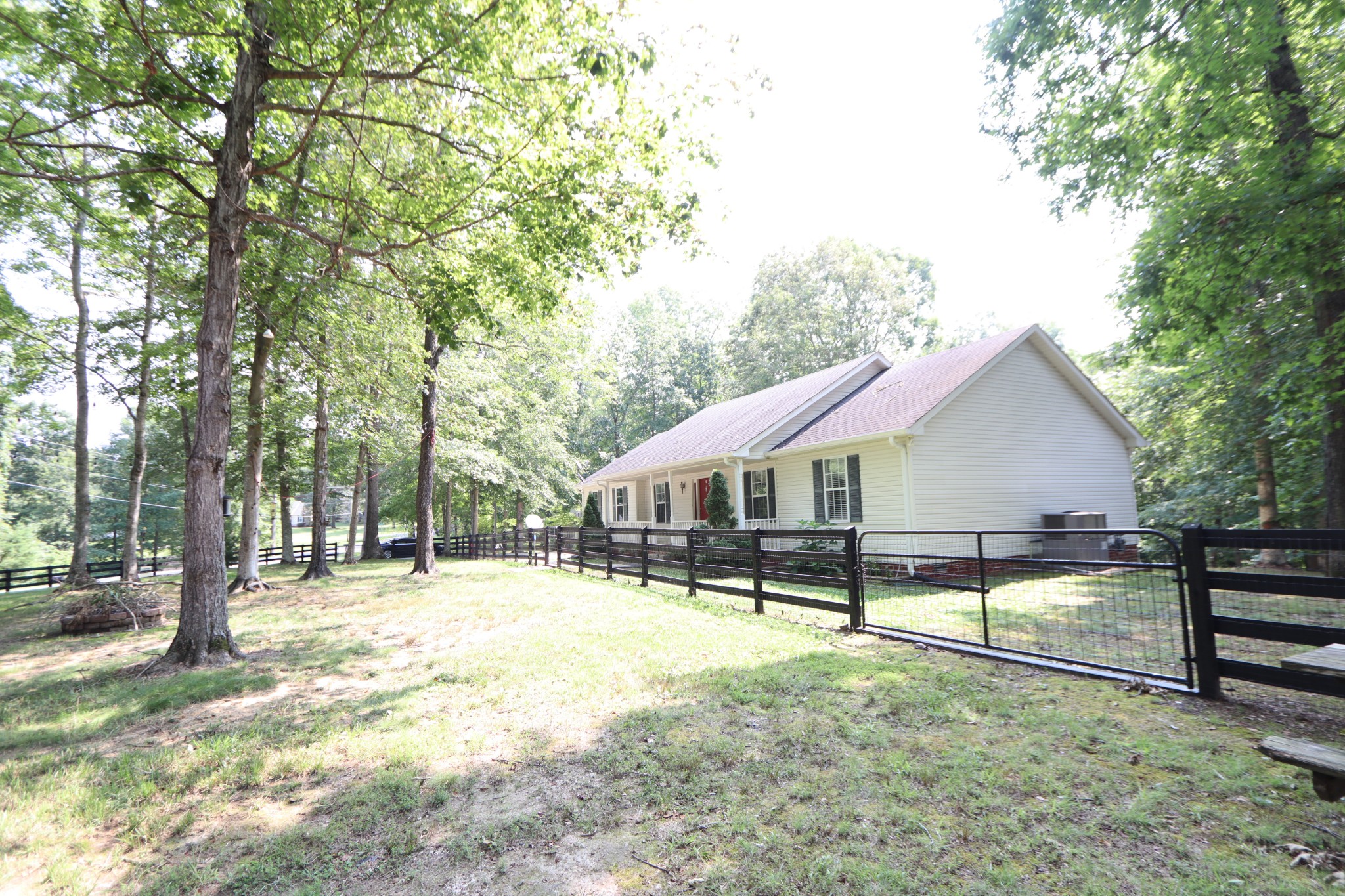 972 Williamson County Line Road Fairview, TN 37062 - Photo 28 of 68 a view of a house with a backyard and sitting area
