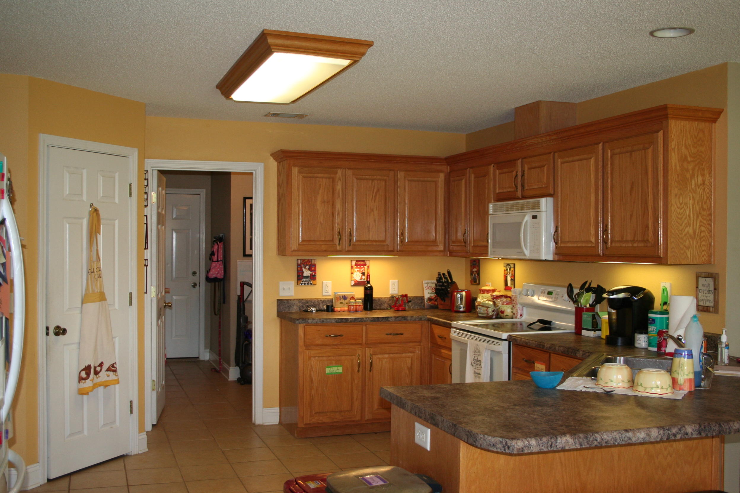 4888 Jennifer Lane Pace, FL 32571 - Photo 6 of 10 a kitchen with a refrigerator and a sink