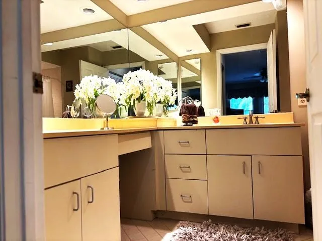 a kitchen with a sink and cabinets