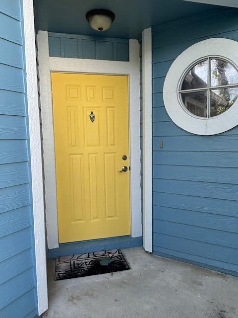 1003 Ocean Dunes Circle Jupiter, FL 33477 - Photo 2 of 33 a view of a door with wooden walls