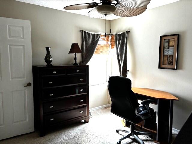 1003 Ocean Dunes Circle Jupiter, FL 33477 - Photo 21 of 33 a view of a workspace with furniture and lamp