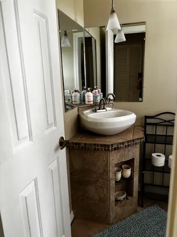 a bathroom with a sink and a mirror