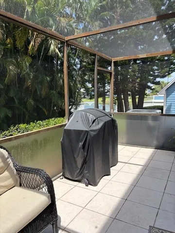 a balcony with furniture and a rug
