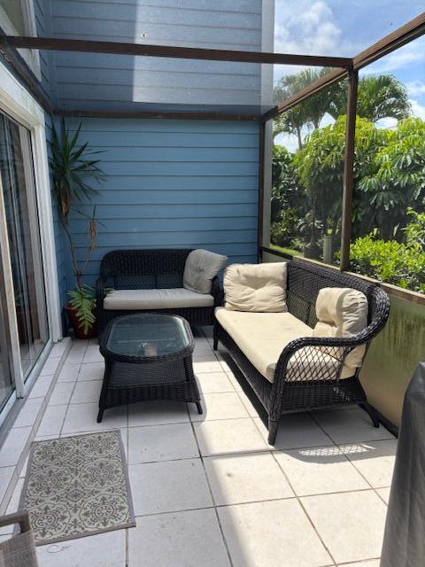 1003 Ocean Dunes Circle Jupiter, FL 33477 - Photo 28 of 33 a balcony with furniture and a rug