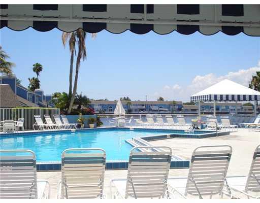 1003 Ocean Dunes Circle Jupiter, FL 33477 - Photo 29 of 33 a view of swimming pool with outdoor seating