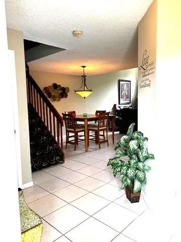 a lobby with furniture and potted plant