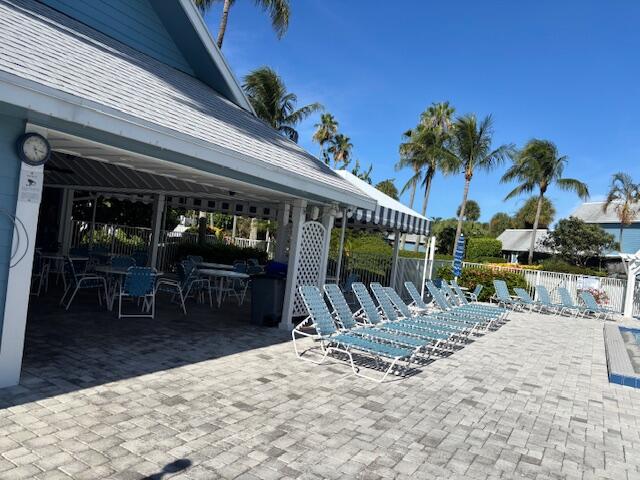 1003 Ocean Dunes Circle Jupiter, FL 33477 - Photo 31 of 33 a view of a dinning tables and chairs in patio