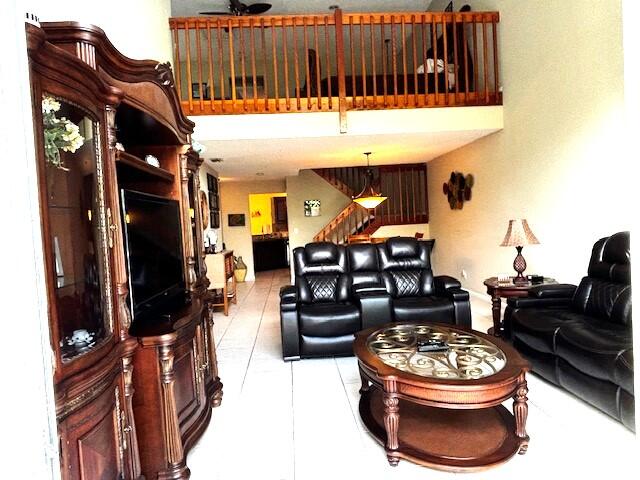 1003 Ocean Dunes Circle Jupiter, FL 33477 - Photo 6 of 33 a living room with furniture and a fireplace