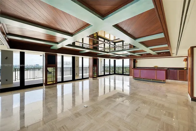 a large kitchen with stainless steel appliances kitchen island granite countertop a large stove top oven and cabinets