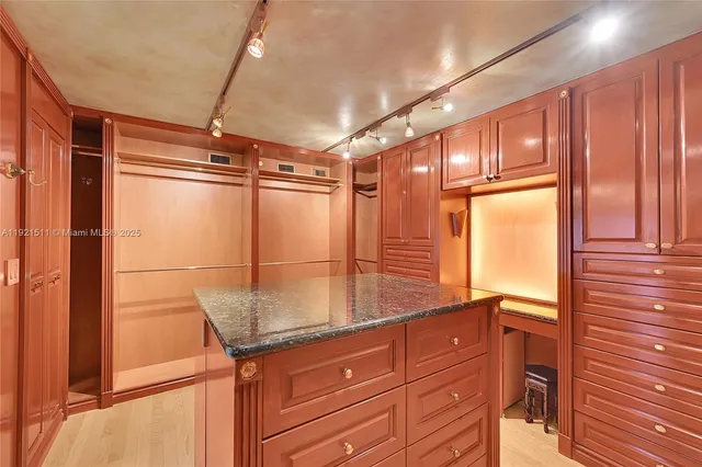 a view of a livingroom with furniture wooden floor and a yard