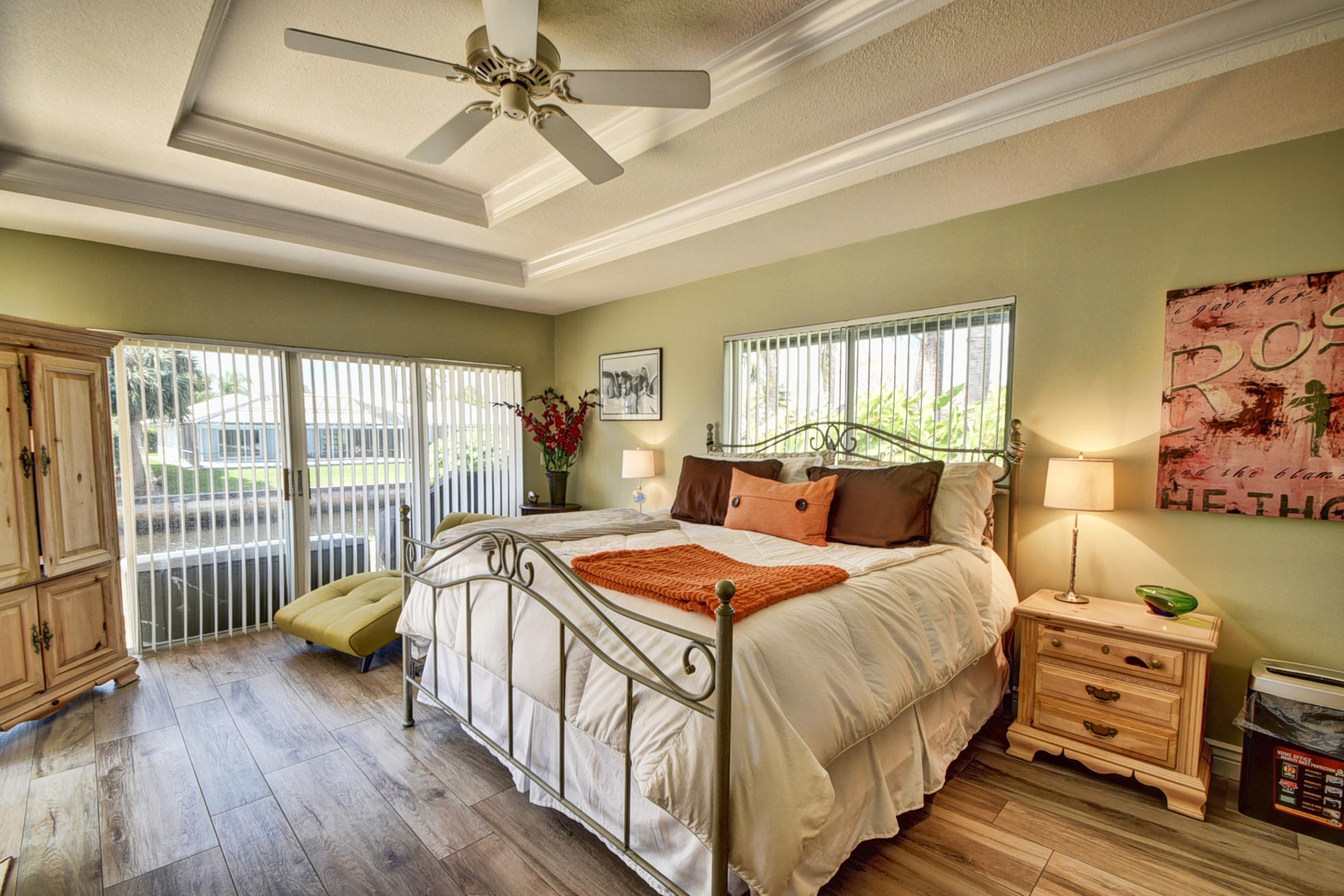 736 Apple Tree Lane Boca Raton, FL 33486 - Photo 15 of 43 a bedroom with a bed and a table