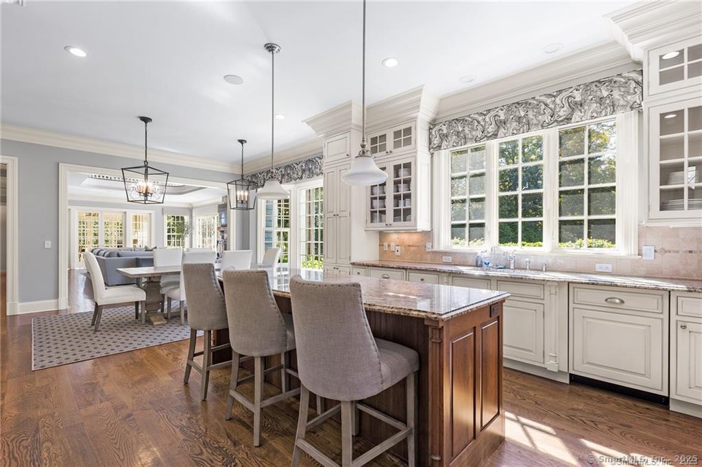 64 Old Redding Road Weston, CT 06883 - Photo 12 of 38 a dining table with chairs and wooden floor