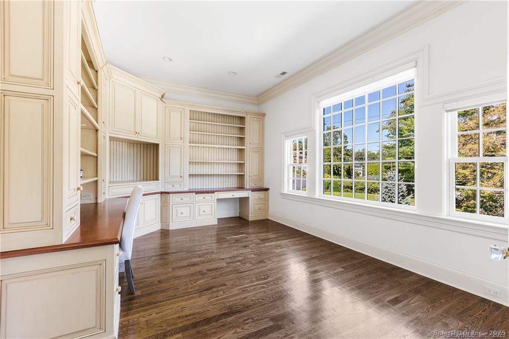 64 Old Redding Road Weston, CT 06883 - Photo 17 of 38 a view of empty room with wooden floor and fan