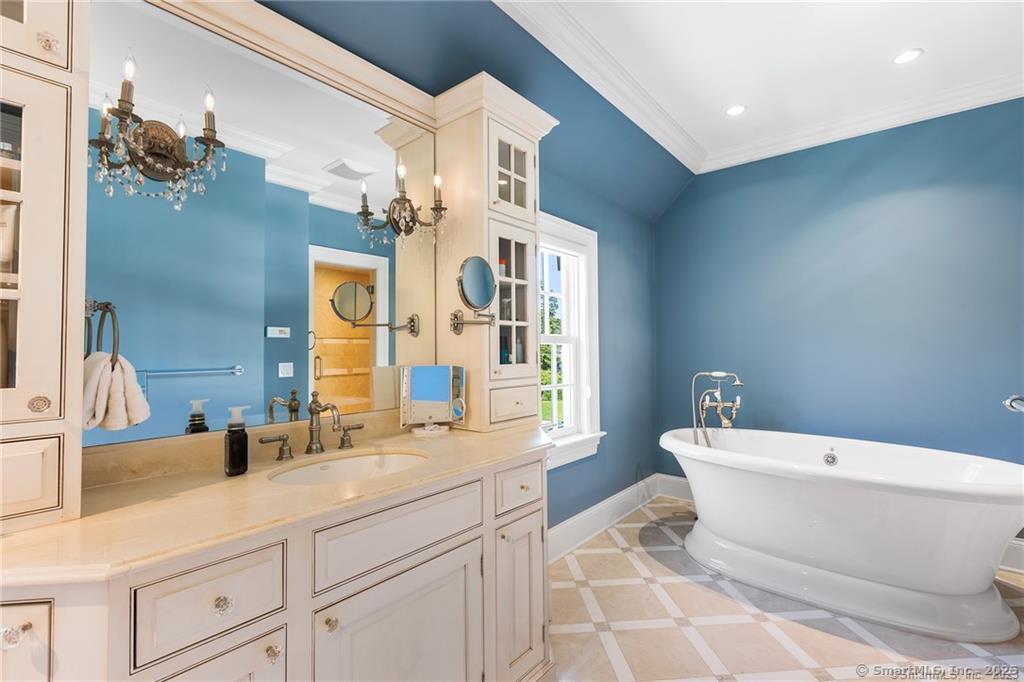 64 Old Redding Road Weston, CT 06883 - Photo 21 of 38 a bathroom with a sink a toilet and a large mirror