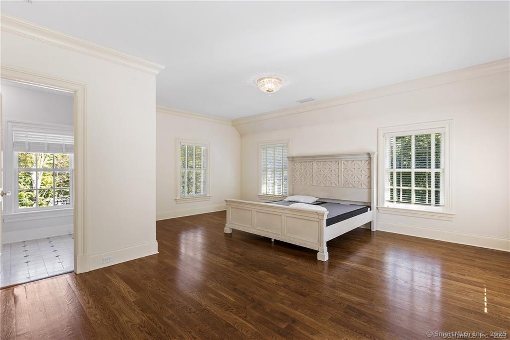 64 Old Redding Road Weston, CT 06883 - Photo 24 of 38 an empty room with wooden floor and window