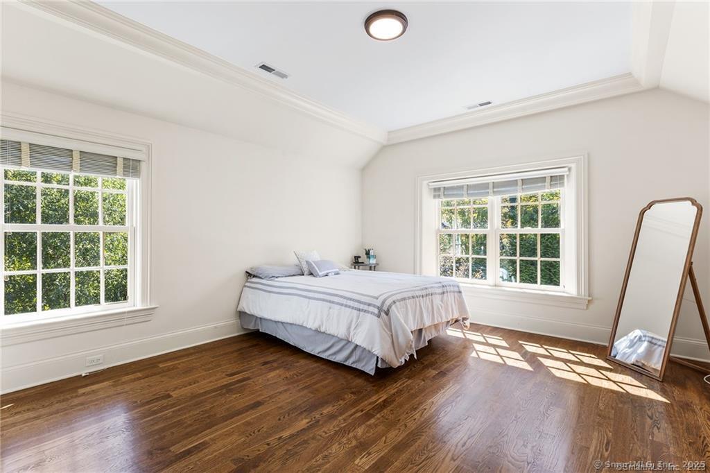 64 Old Redding Road Weston, CT 06883 - Photo 25 of 38 a spacious bedroom with a bed and a large window