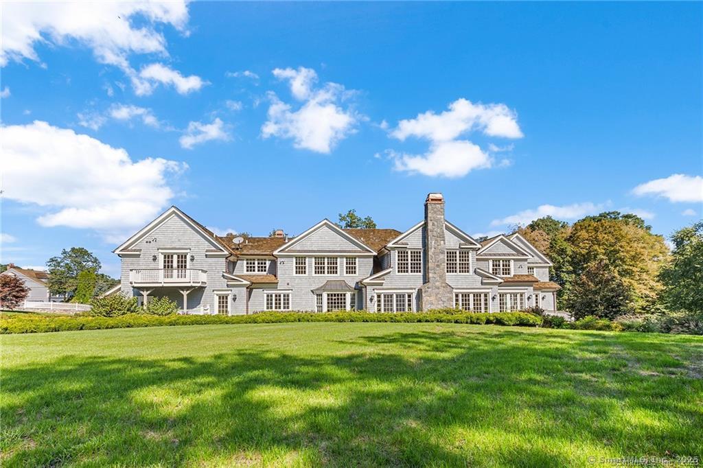64 Old Redding Road Weston, CT 06883 - Photo 28 of 38 a view of a house with a big yard and large trees