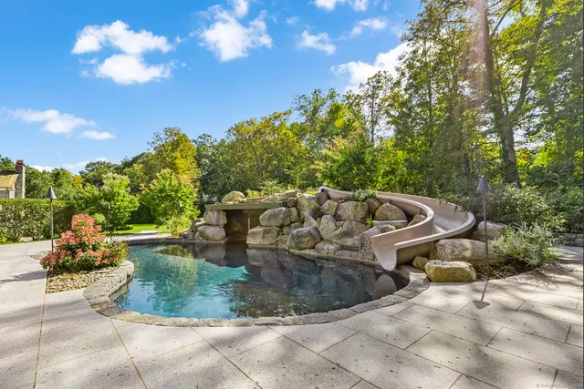 a view of a fountain in the patio of a house