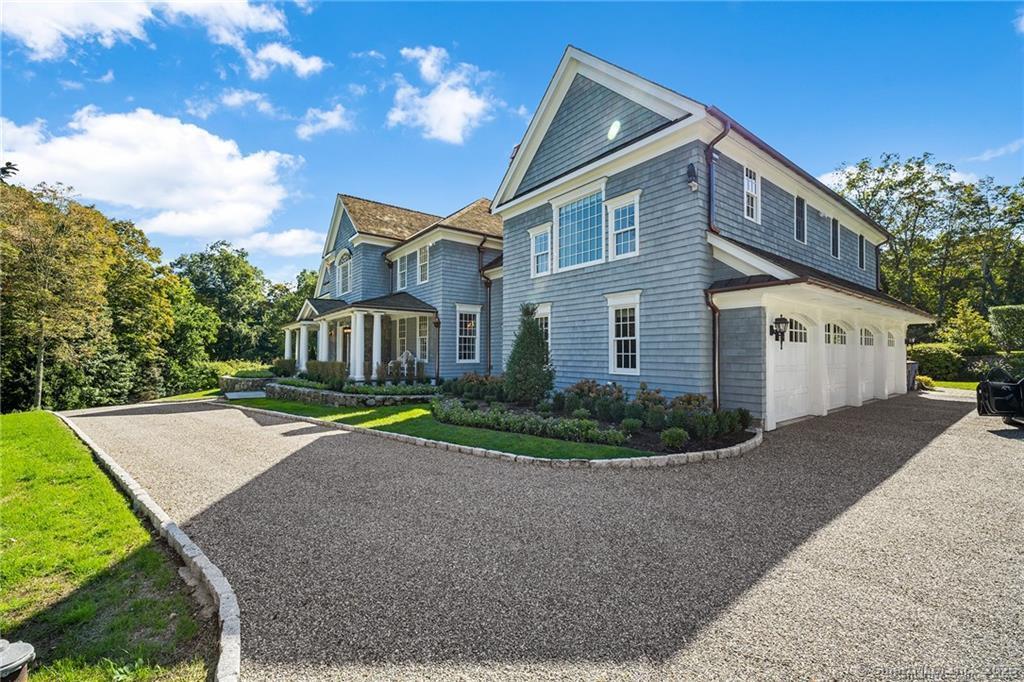 64 Old Redding Road Weston, CT 06883 - Photo 37 of 38 a front view of a house with a yard and garage