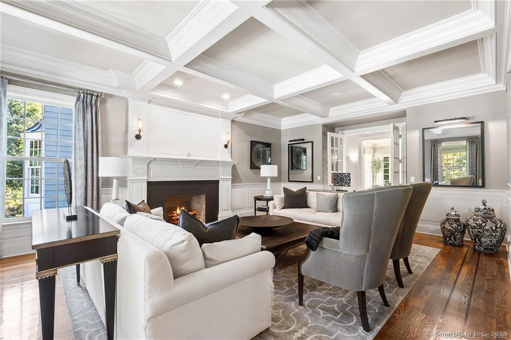 64 Old Redding Road Weston, CT 06883 - Photo 6 of 38 a living room with furniture fireplace and a large window