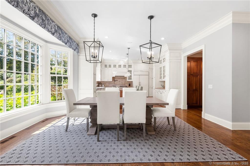 64 Old Redding Road Weston, CT 06883 - Photo 10 of 38 a dining room with furniture a chandelier and wooden floor