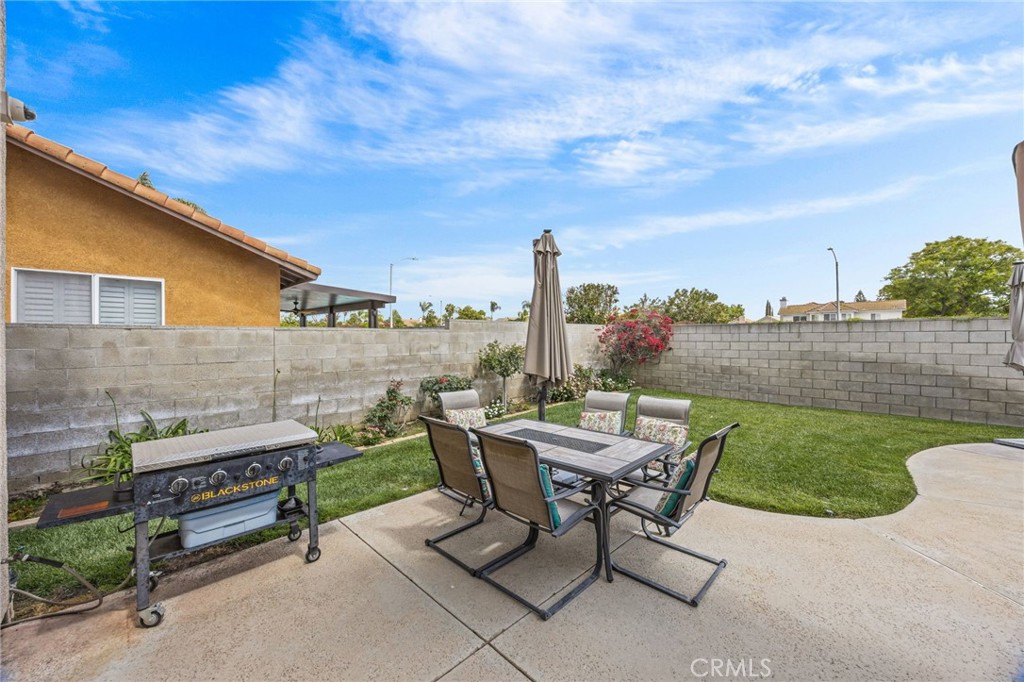 20257 Edmund Road Riverside, CA 92508 - Photo 43 of 53 a view of a terrace with furniture and a garden