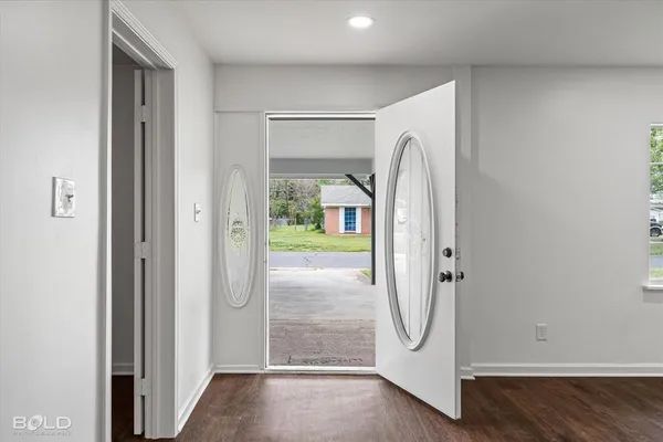 a view of a bathroom with a glass door shower