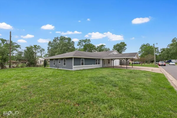 a view of a house with a big yard
