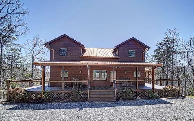 720 Deer Crest Overlook Blue Ridge, GA 30513 - Photo 1 of 1 a front view of a house with garden