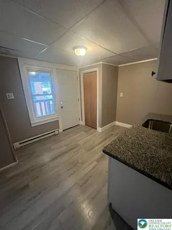 a view of an empty room and window