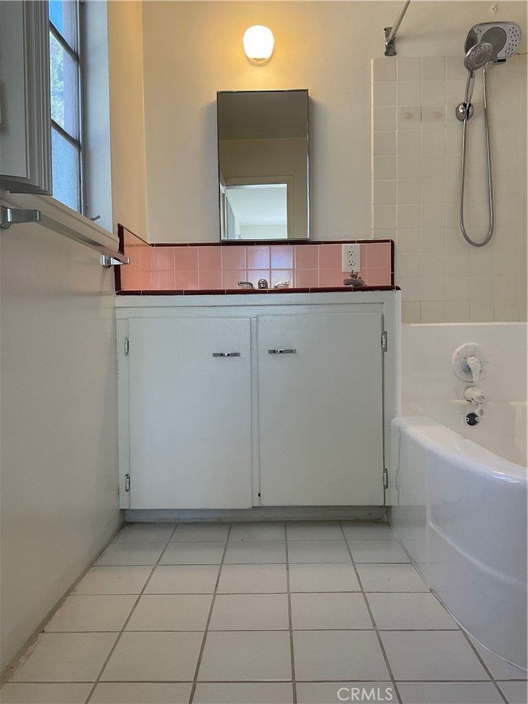 357 Grant Street, Unit A Redlands, CA 92373 - Photo 11 of 11 a bathroom with a bathtub and a sink