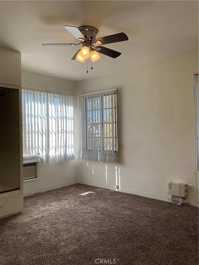 357 Grant Street, Unit A Redlands, CA 92373 - Photo 5 of 11 a view of an empty room with a window