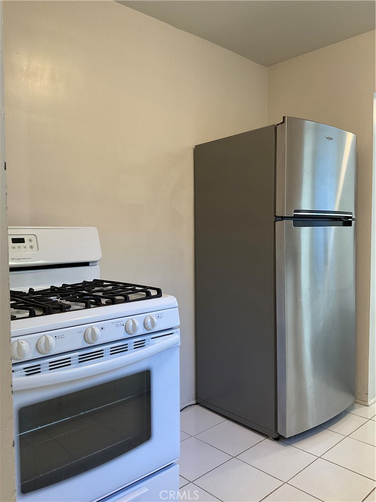 357 Grant Street, Unit A Redlands, CA 92373 - Photo 7 of 11 a stove top oven sitting inside of a kitchen