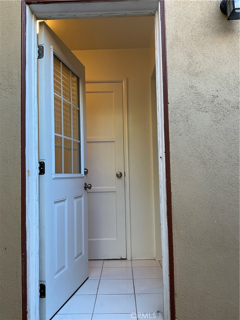 357 Grant Street, Unit A Redlands, CA 92373 - Photo 8 of 11 a view of a hallway with wooden floor and a cabinet