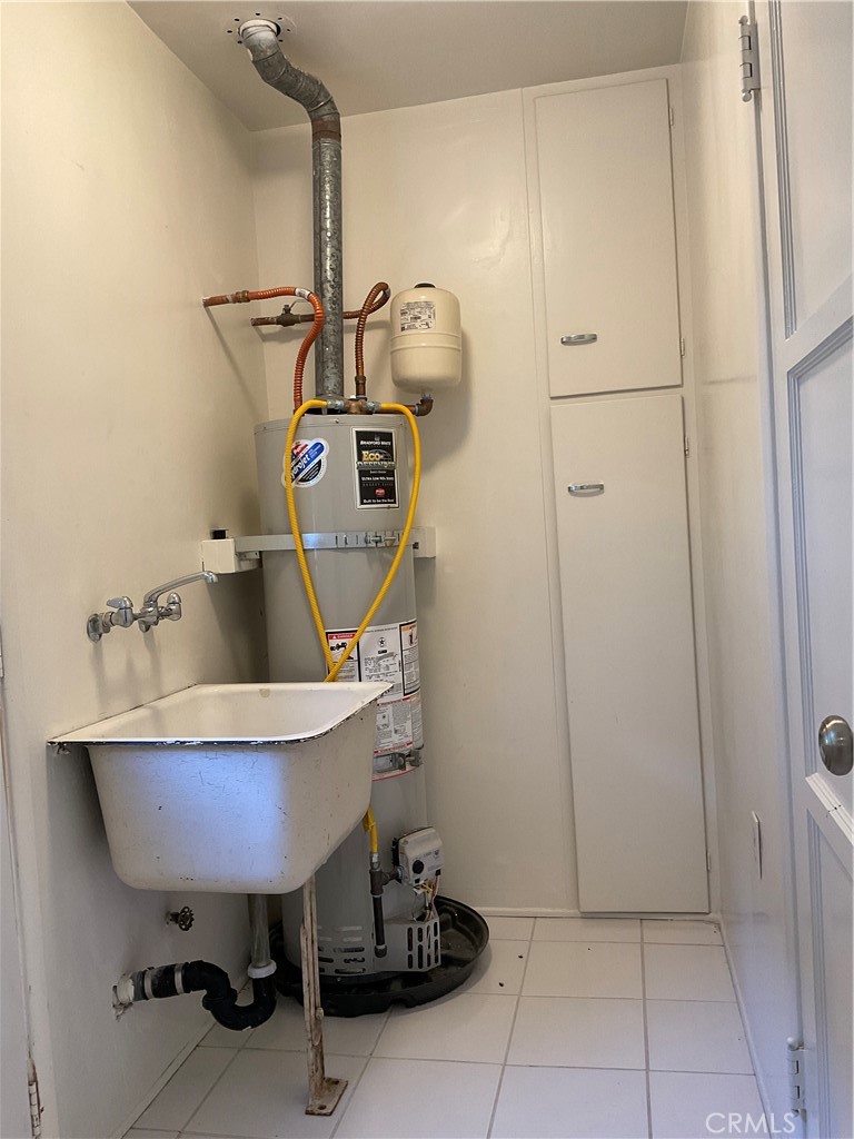 357 Grant Street, Unit A Redlands, CA 92373 - Photo 9 of 11 a bathroom with a sink a toilet and a mirror