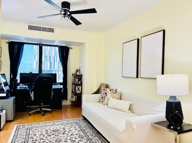 530 East 76th Street, Unit 35H36H Manhattan, NY 10021 - Photo 15 of 16 a living room with furniture and a window