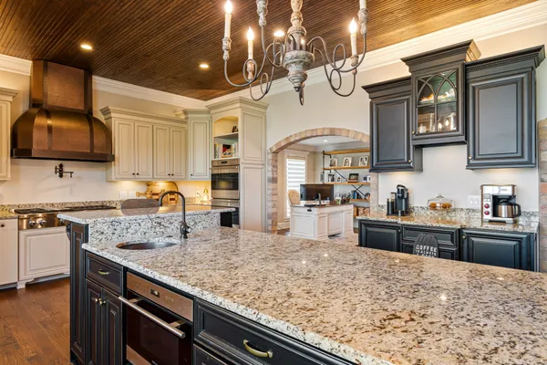 a open kitchen with sink cabinets and wooden floor