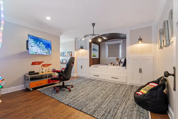 a view of a chair and table in backyard of the house
