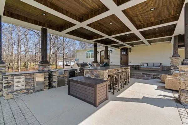 a view of backyard with wooden fence