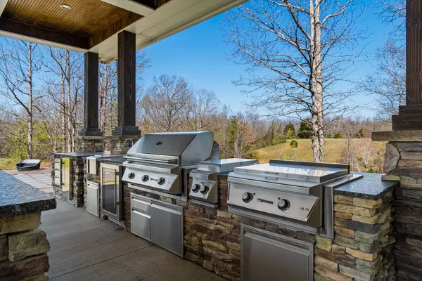 a view of outdoor space with deck and tree