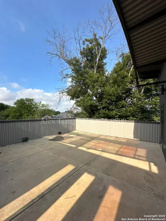 a view of balcony with yard