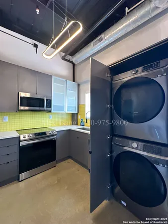 a kitchen with a sink and a stove